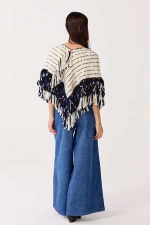 
                  
                    Poncho Fun en lana merino - Natural con Azul
                  
                